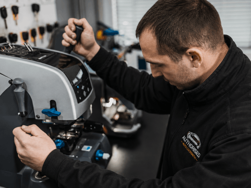 Auto locksmith programming a new car fob from scratch after the original was lost in Essex