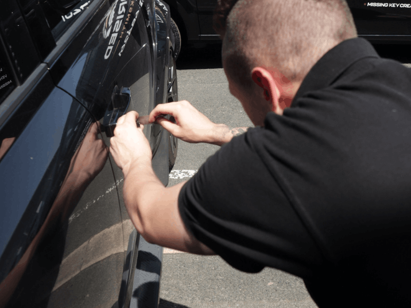 car lockout Essex — auto locksmith opening a locked vehicle on the roadside