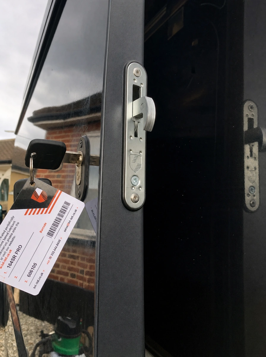 Auto locksmith fitting a van deadlock in Harlow, Essex