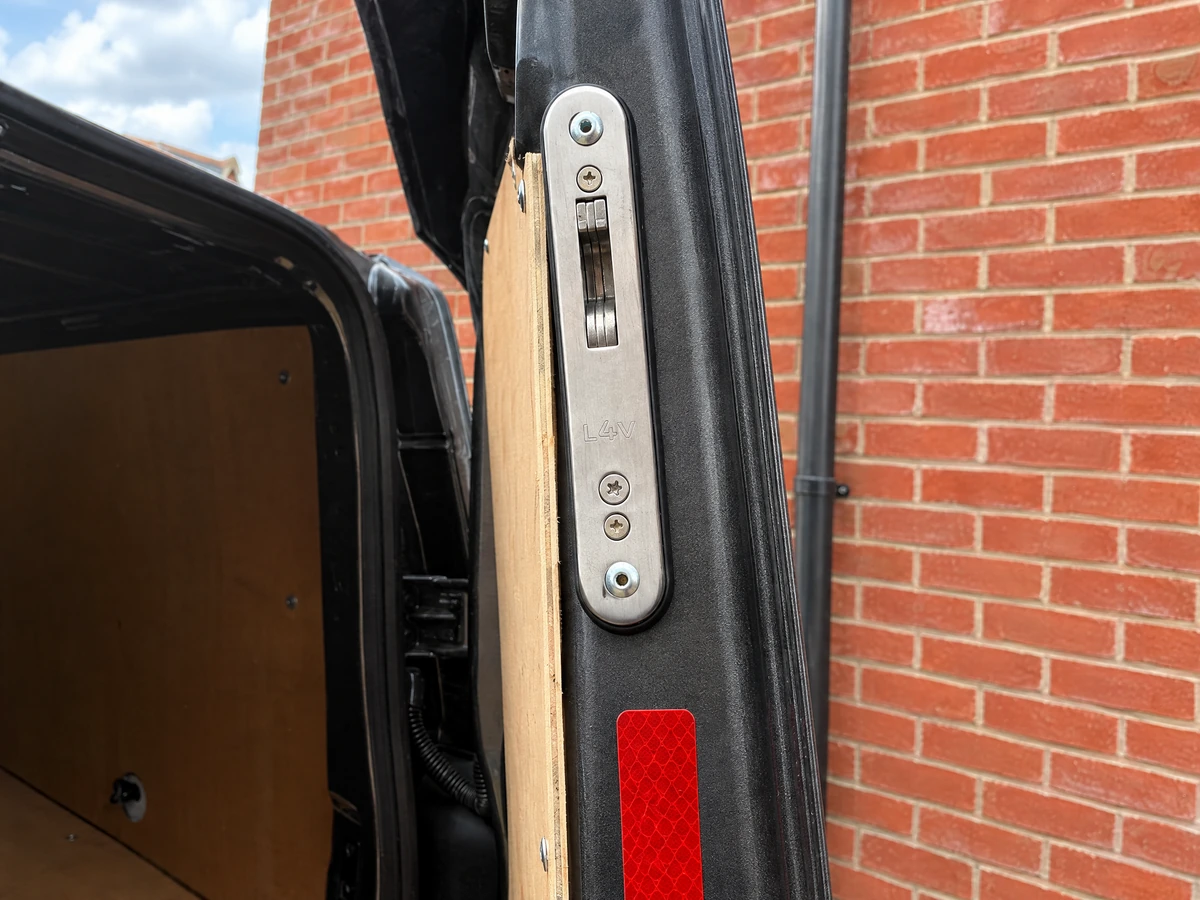 Deadlock being installed on the rear door of a work van in Essex